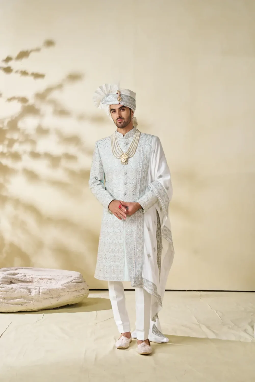 Pastel green sherwani set with geometric embroidery