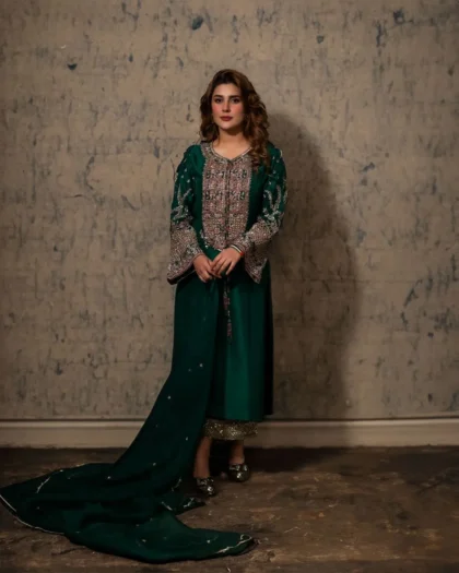Full length view of green party wear hand embroidered silk dress with dupatta and trousers