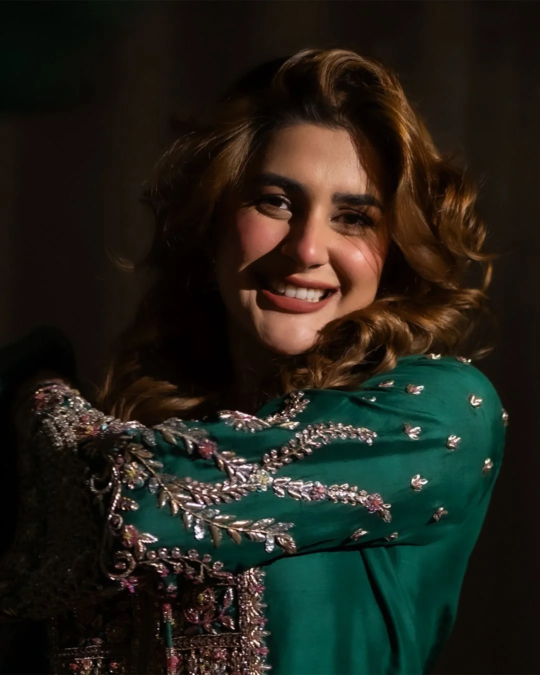 Medium shot of Kubra Khan in green silk formal shirt with zardozi details