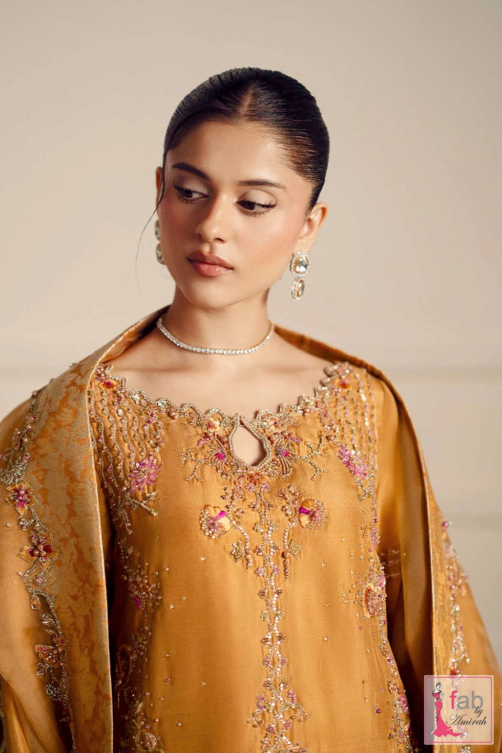 Close up of keyhole neckline and intricate zardozi embroidery details