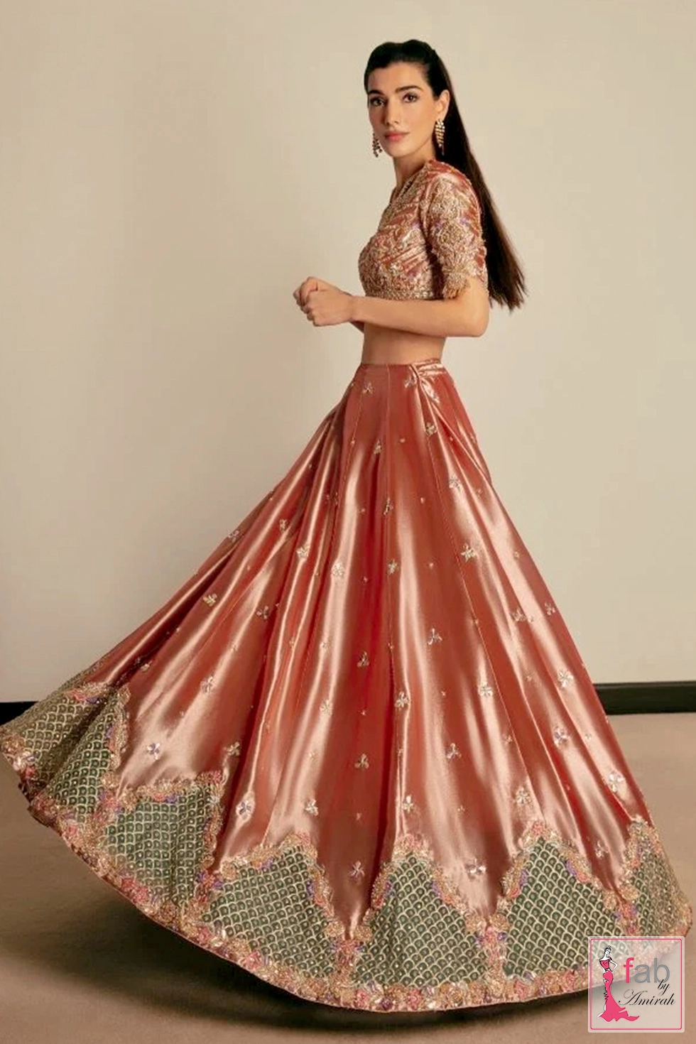 Side profile angle showing metallic sheen and embroidered skirt hem lattice
