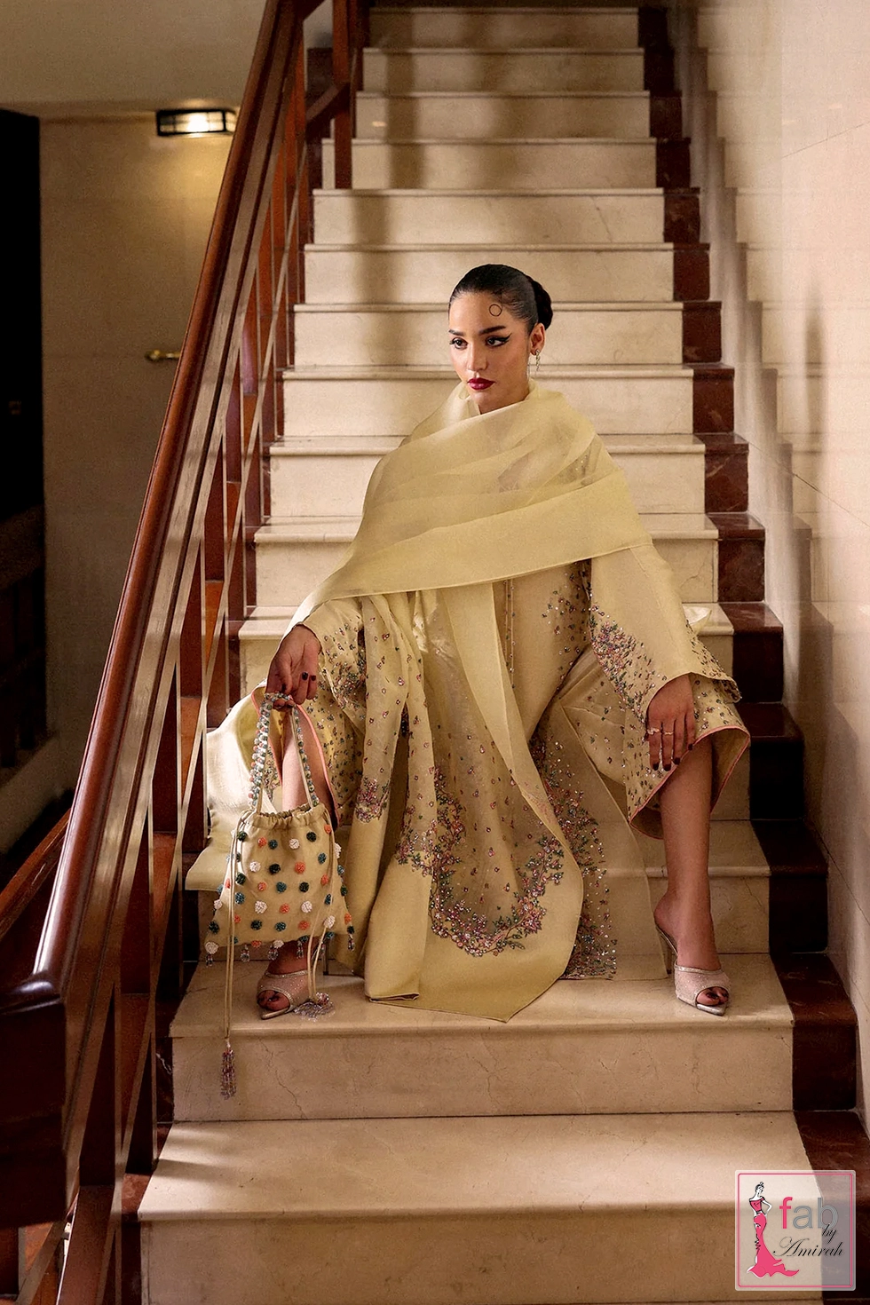 Seated pose displaying the sheer organza dupatta draped casually Seated pose displaying the sheer organza dupatta draped casually