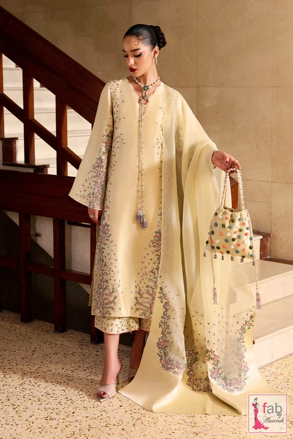 Full length view of the butter yellow suit with matching embroidered purse Full length view of the butter yellow suit with matching embroidered purse