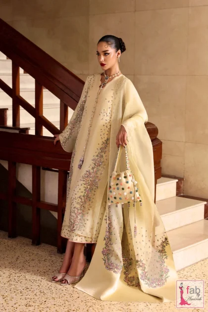 Model wearing a raw silk dress in yellow with hand embroidered panels