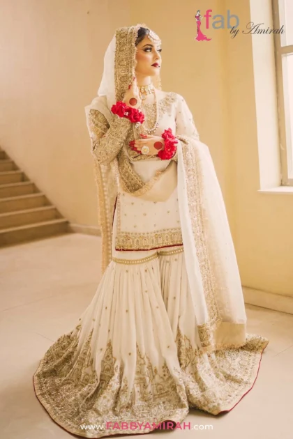 Intricate silver Zardozi jaal work on off-white gharara dress for nikah