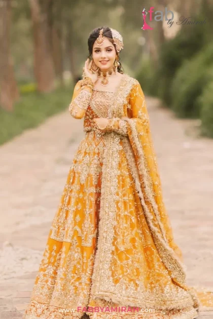 Luxury bridal lehnga in orange and gold organza with heavy Resham work by Fab By Amirah