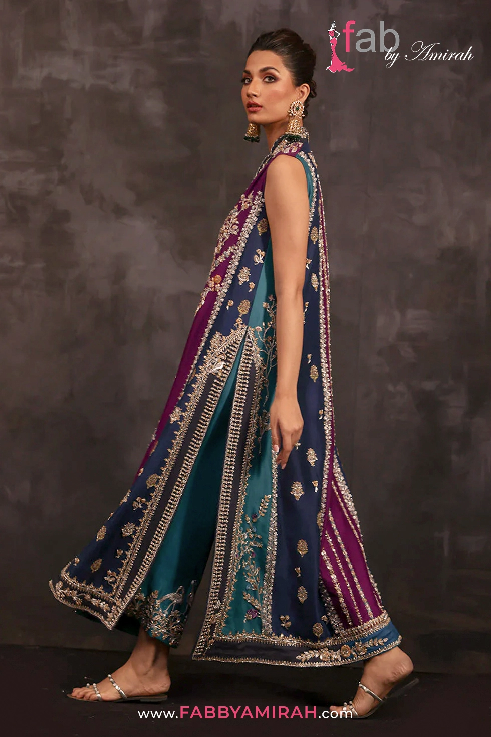 Close-up of zardozi and silk thread peacock embroidery on Silk Bridal Chogha Close-up of zardozi and silk thread peacock embroidery on Silk Bridal Chogha