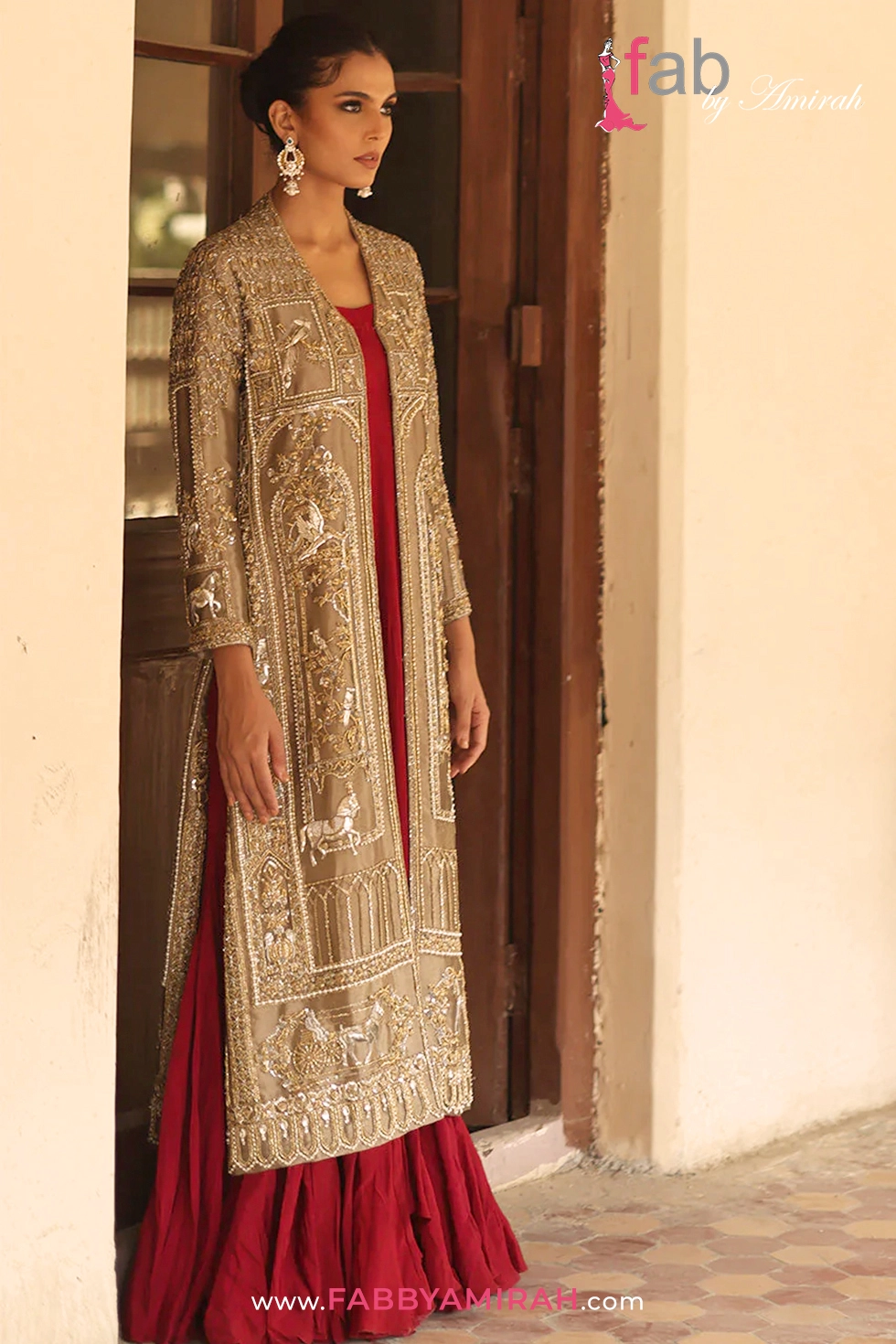 Breathtaking metallic gold front open long gown with modern side slits and architectural motifs