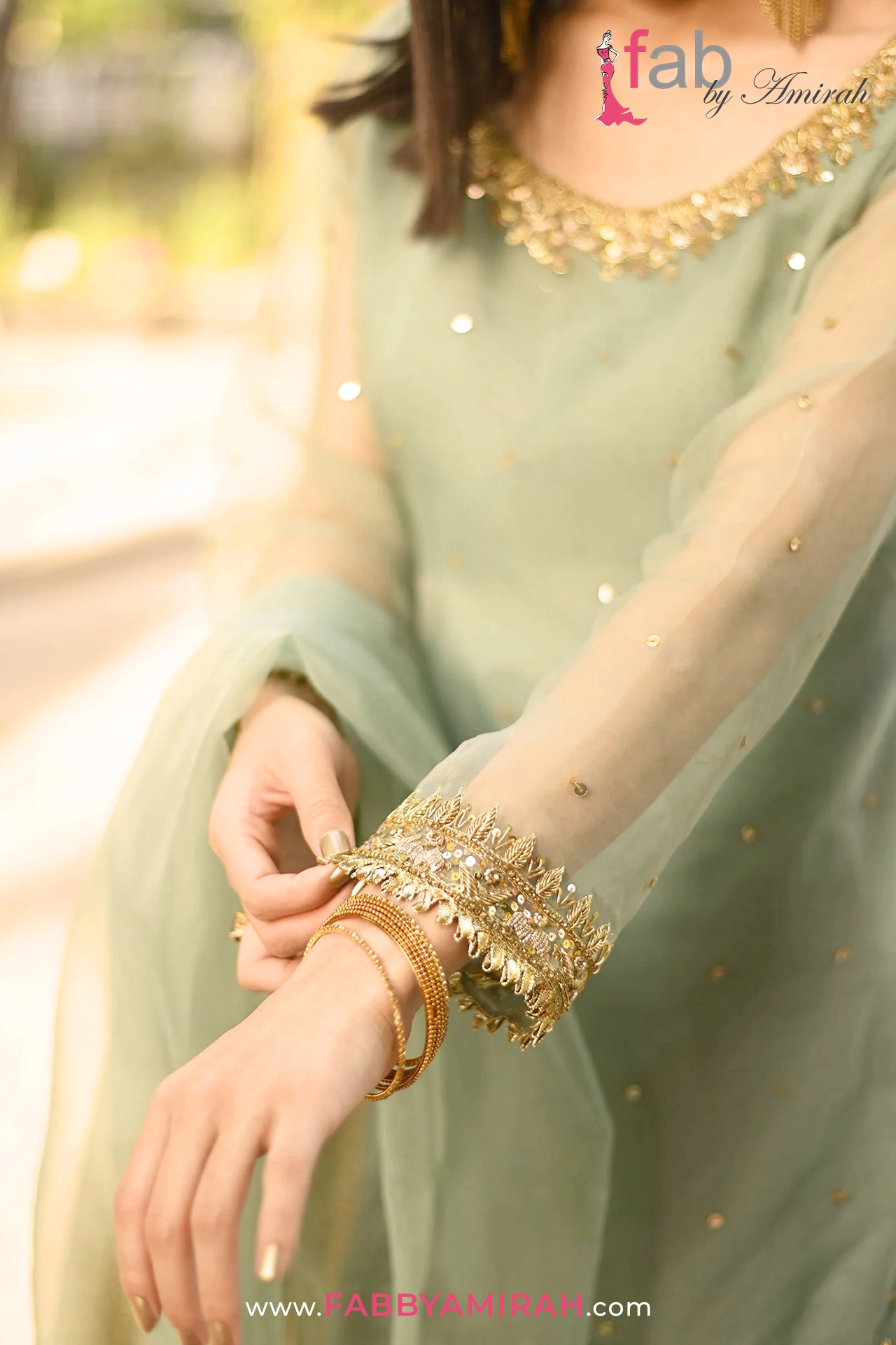 Alternate view of organza shirt showing gold dabka borders on light ferozi organza sharara set Alternate view of organza shirt showing gold dabka borders on light ferozi organza sharara set