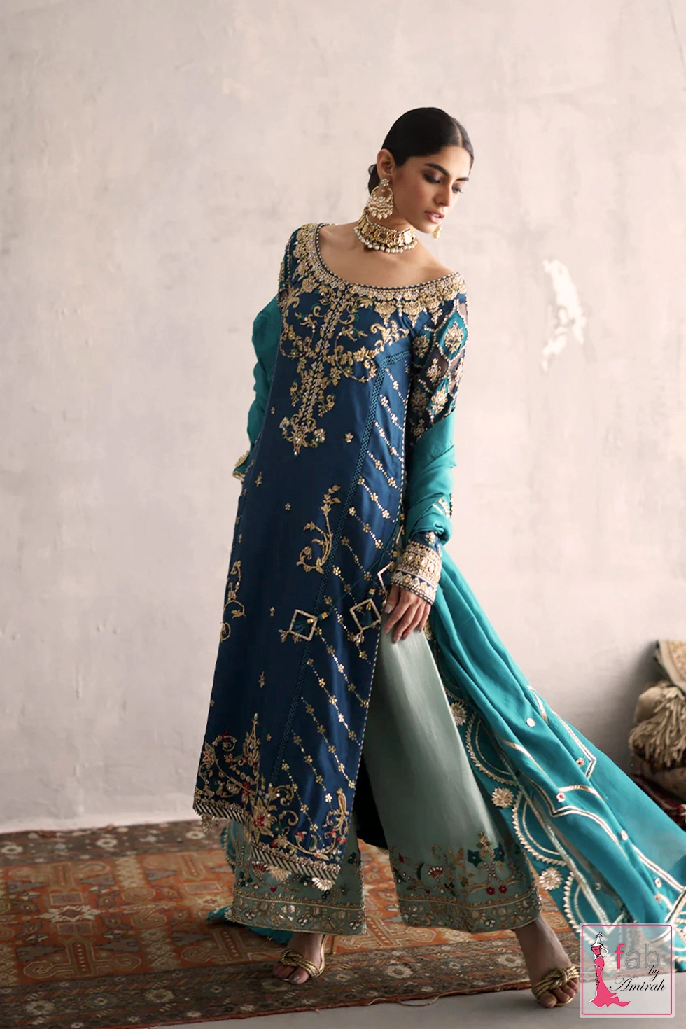 Complete turquoise wedding wear ensemble with emerald green organza dupatta