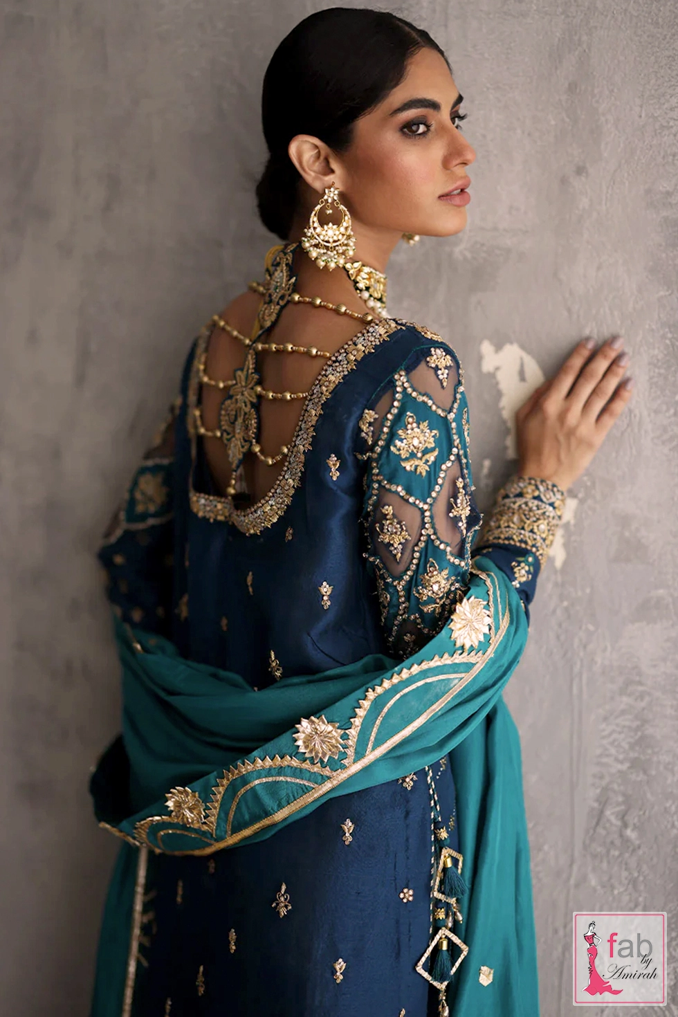 Net applique work on long straight raw silk shirt sleeves close up