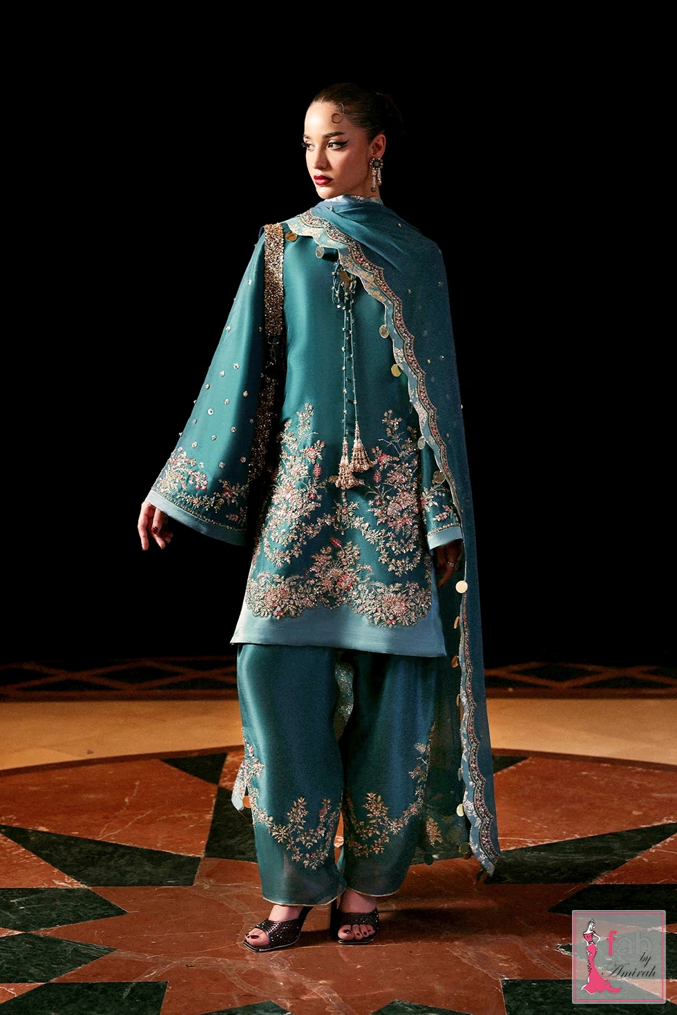 Teal blue hand embroidered party wear dress with embellished hem