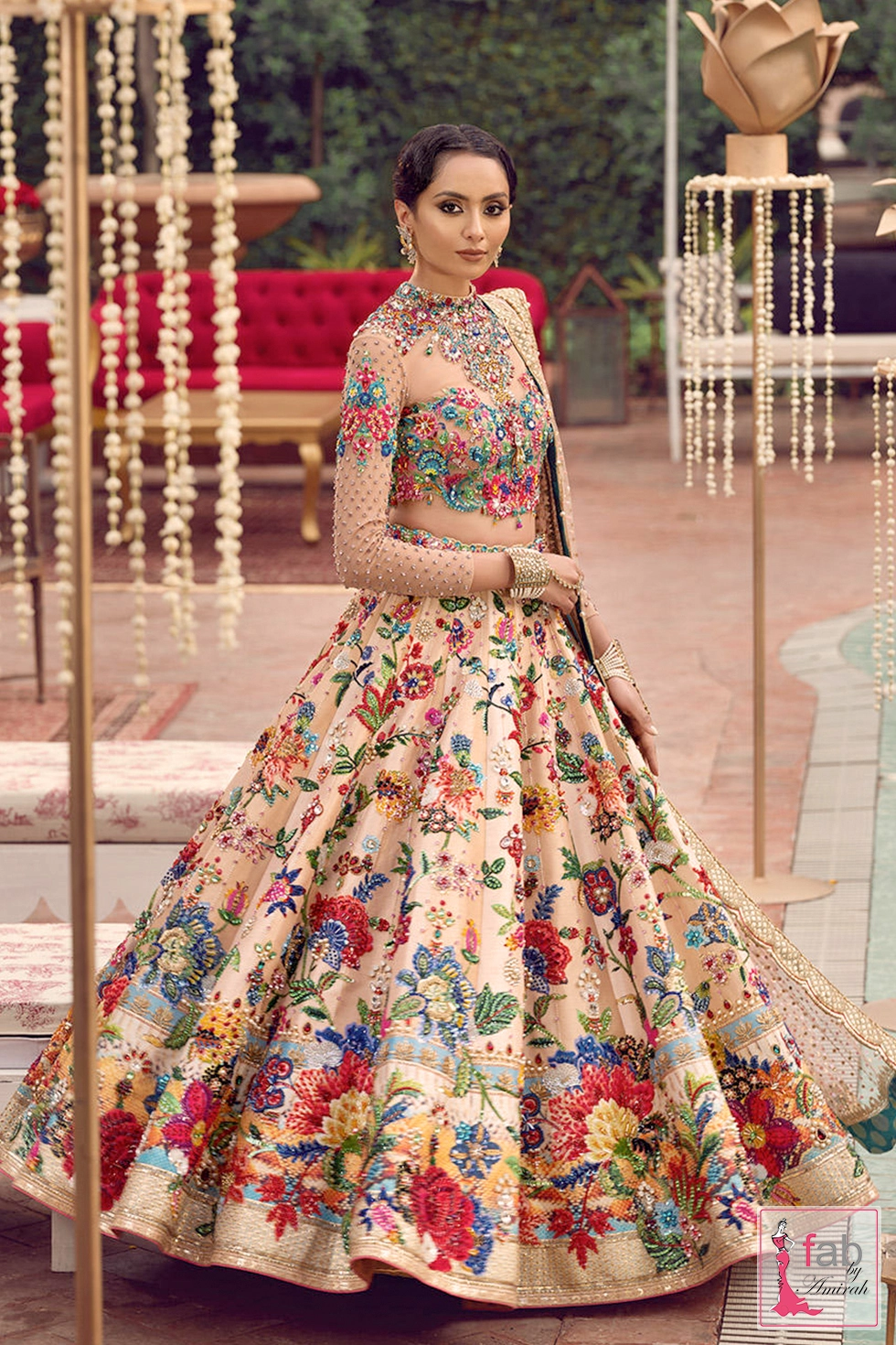 Full standing flare view of peach embroidered lehenga skirt