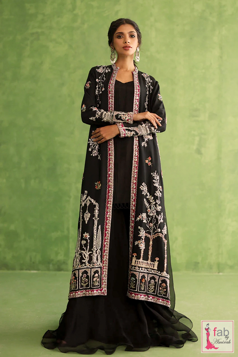 Black flared pants showing sheer organza fabric insert panel detailing