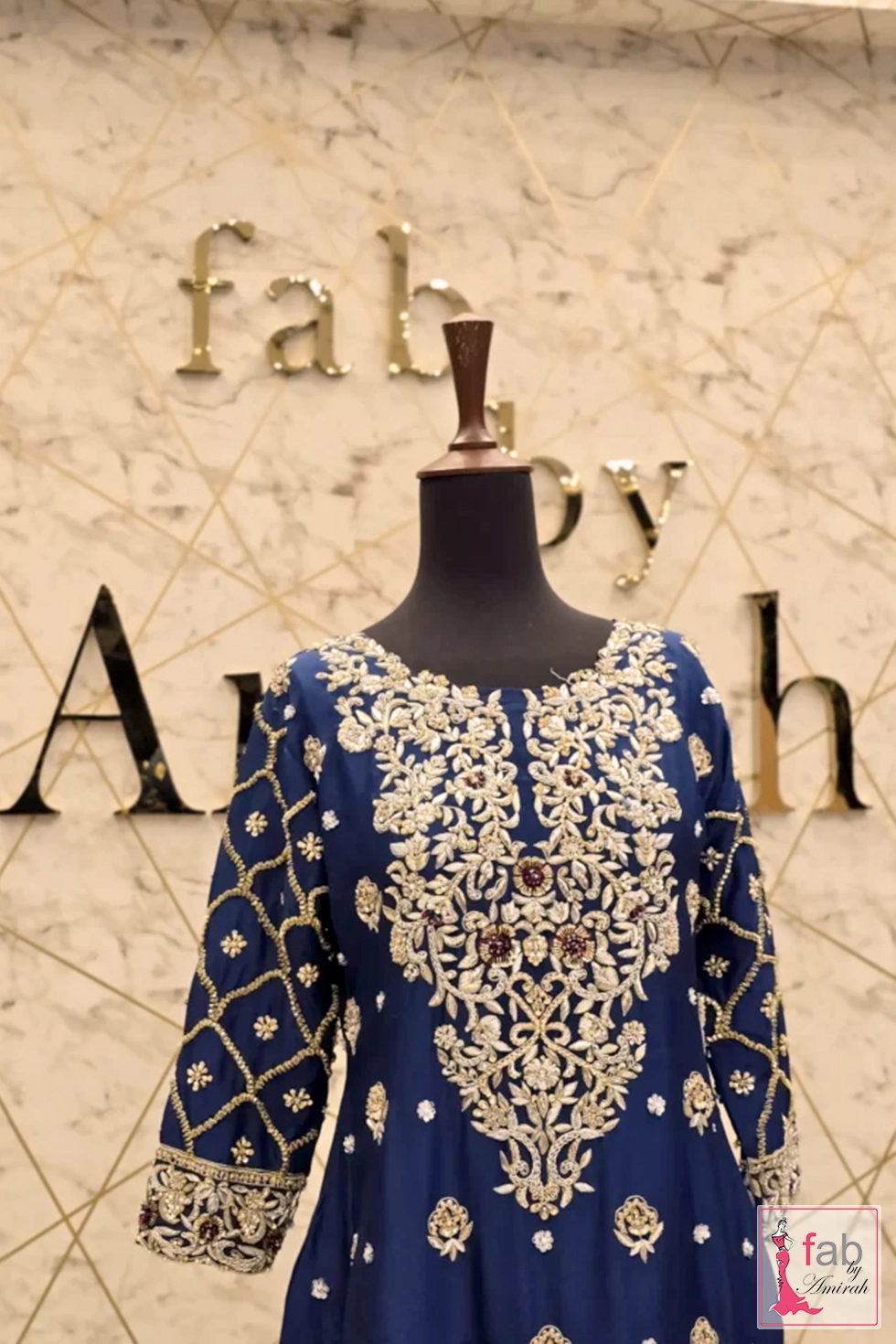 Close up detail of heavily hand embroidered neckline and sleeves