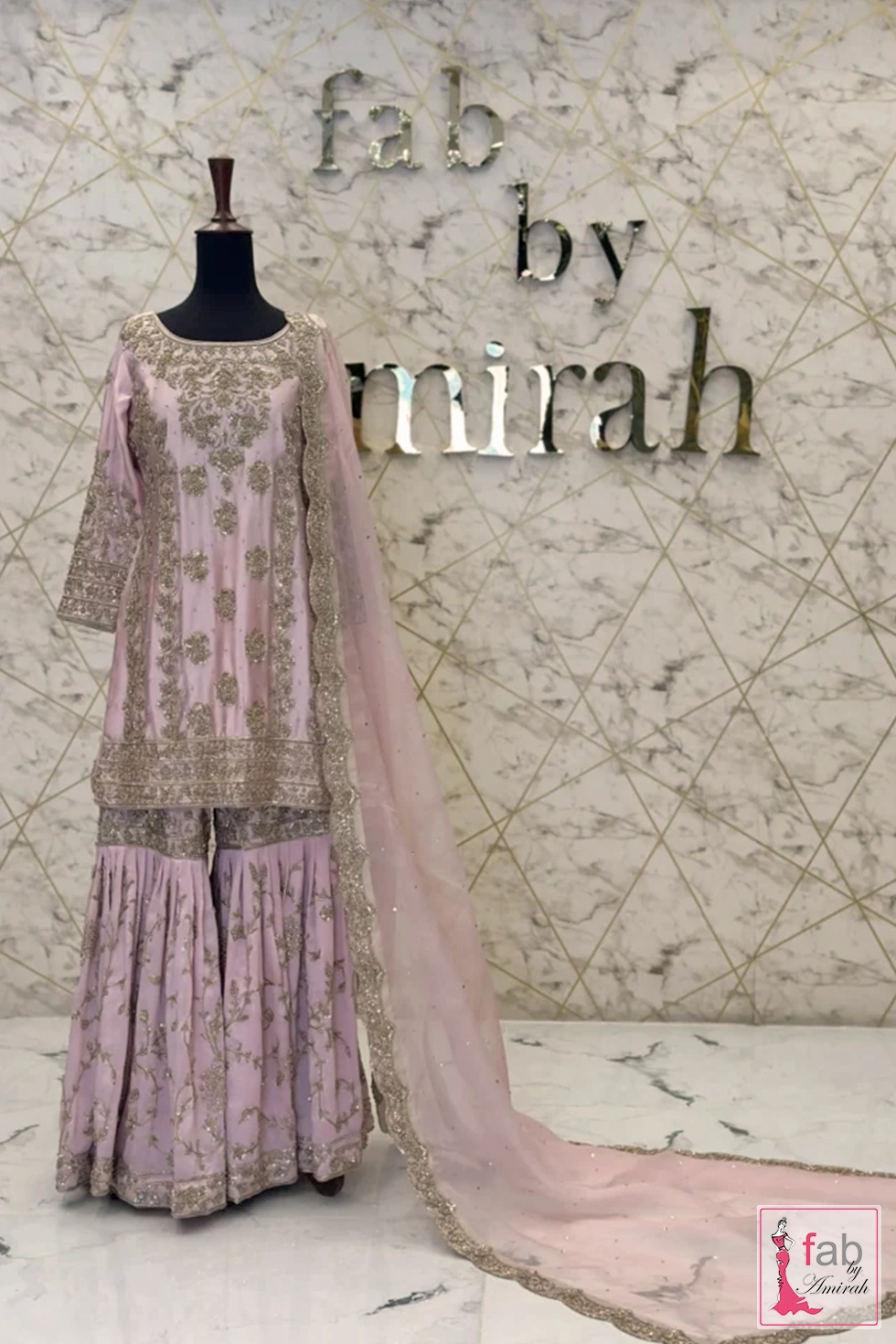 Pink party wear shirt with pleated gharara full length display on mannequin