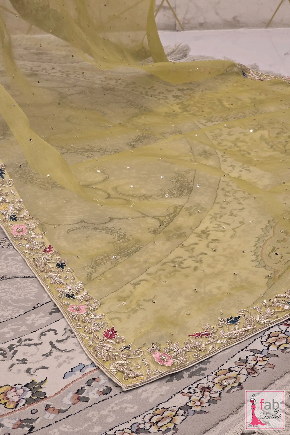 Flat lay view of soft net dupatta with embellished border Flat lay view of soft net dupatta with embellished border