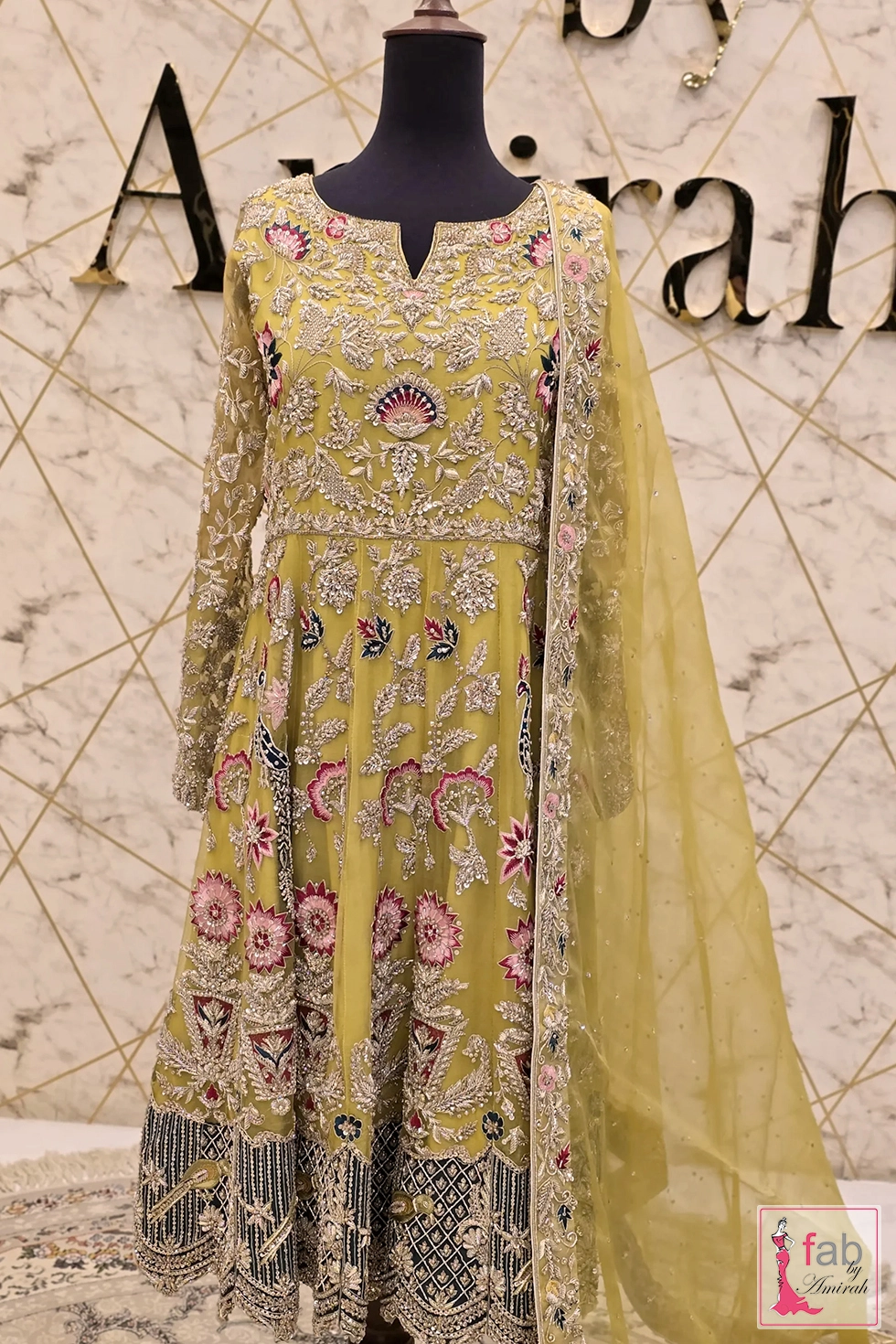 Radiant Yellow Hand Embroidered Maxi Dress with Fine Detail 1 Radiant yellow hand embroidered maxi dress full length display on mannequin