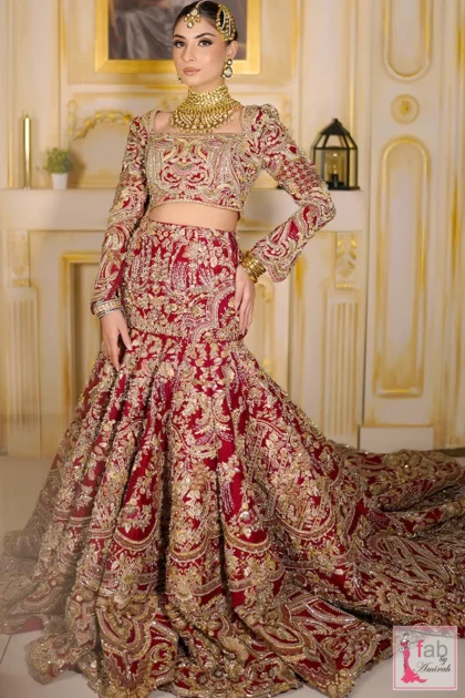 Full length red raw silk bridal lehenga dress for barat with intricate gold embroidery