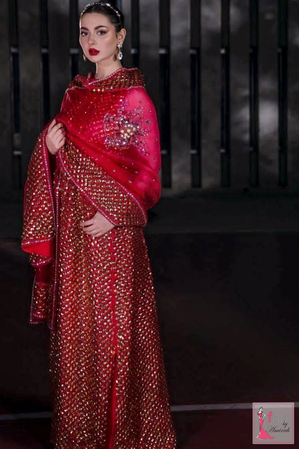 Red georgette party wear dress featuring all over gold sequin embroidery
