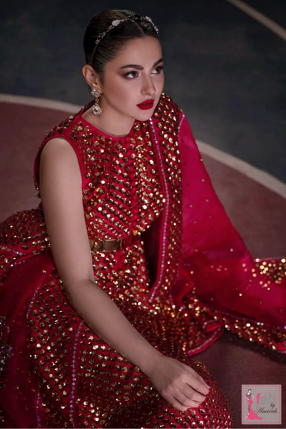 Full length view of red embroidered dress with draped matching dupatta