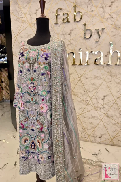 Hand embroidered formal wear grey long shirt and dupatta ensemble on mannequin