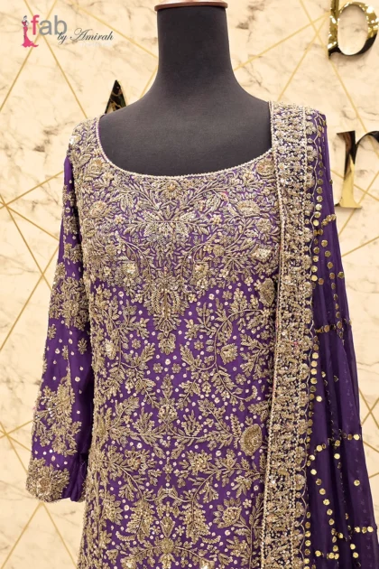 Close up of intricate gold zardozi hand embroidery on neckline