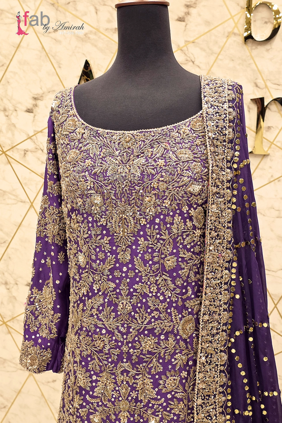 Close up of intricate gold zardozi hand embroidery on neckline
