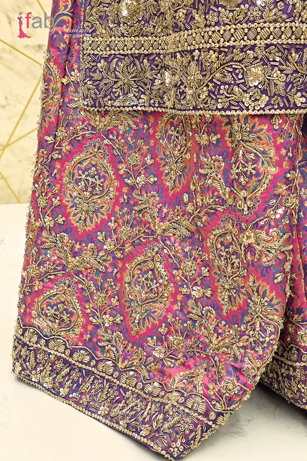Detail shot of woven brocade skirt with elaborate hand embroidered hem