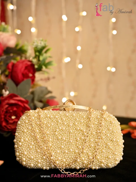 Matching the Sparkle: How to Pair Luxury Clutches with Your Bridal Look 1 Fab By Amirah Luxury Gold Bridal Clutch Bag with Ivory Pearls and Gold Chain