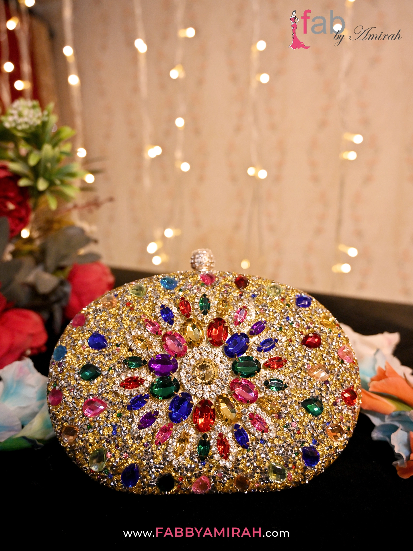 Close-up of rainbow crystals and gold stones on a luxury wedding purse
