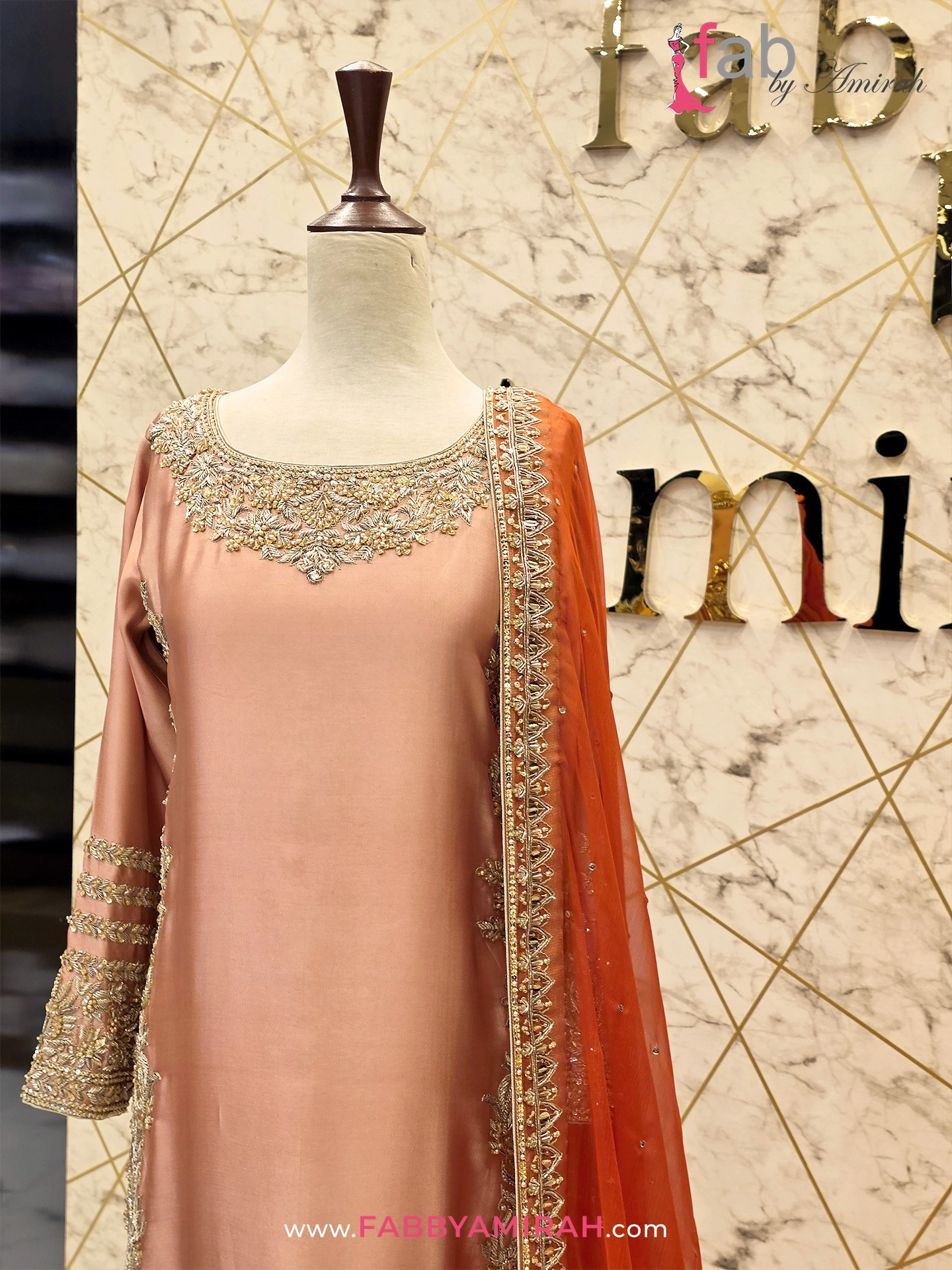 Back view of peach long shirt showing detailed Tilla and pearl patterns