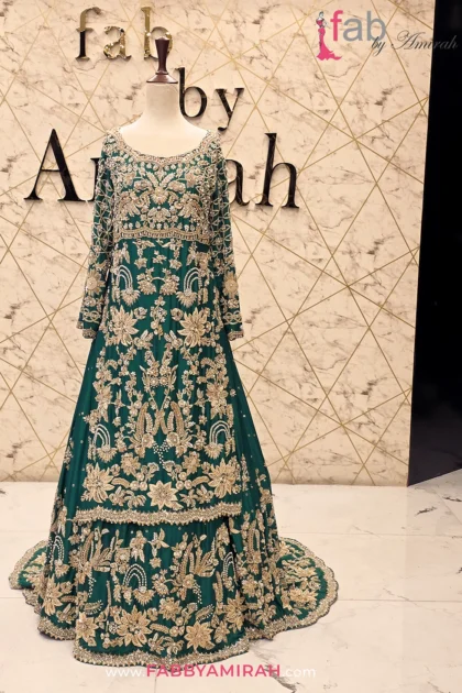 Hand embellished green bridal lehenga set with intricate gold embroidery detail