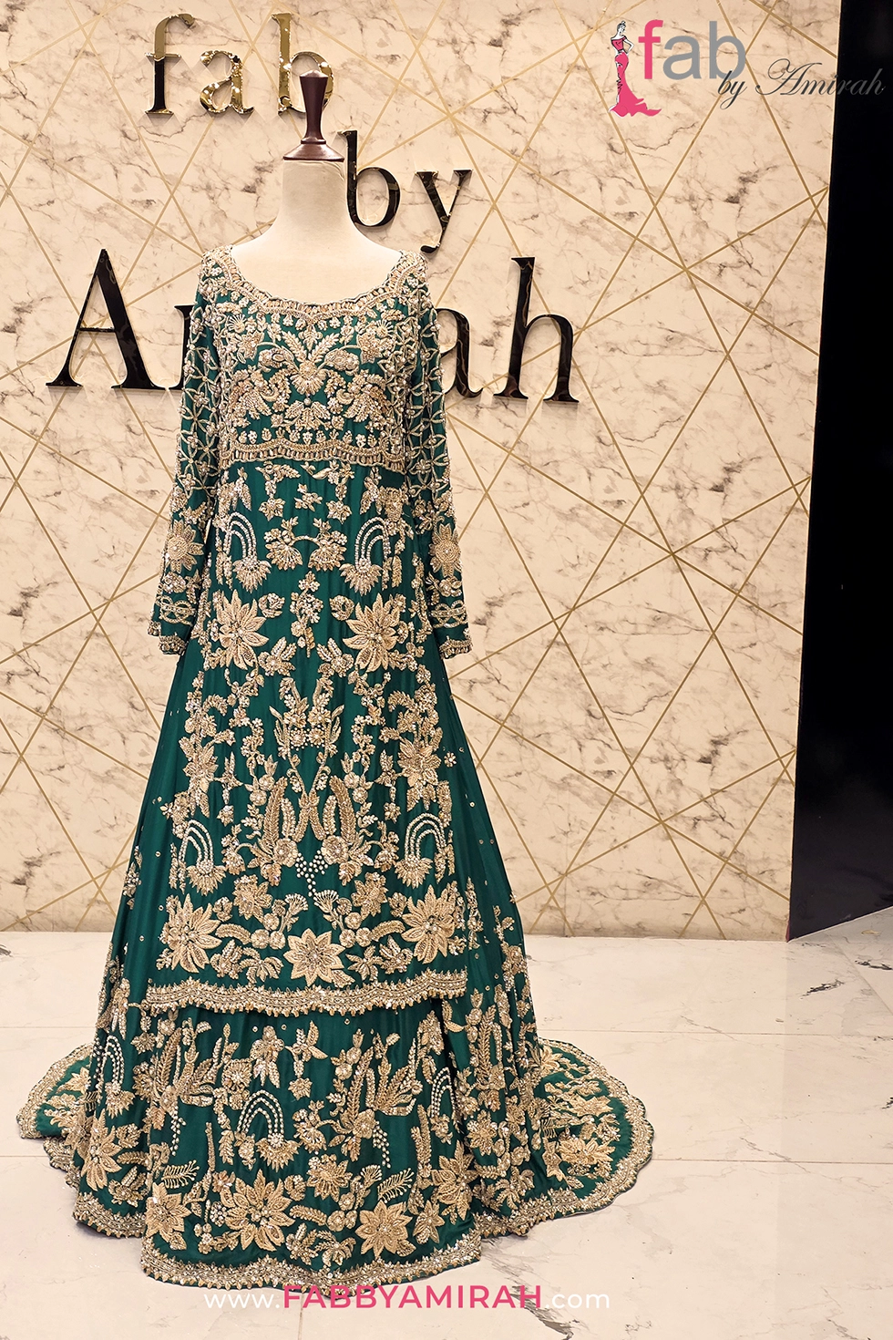 Hand embellished green bridal lehenga set with intricate gold embroidery detail