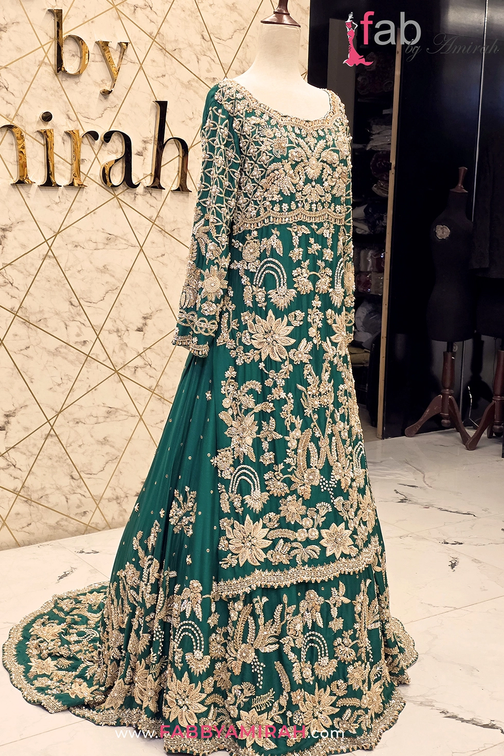 Side view showing detailed sleeve embroidery and flared lehenga silhouette