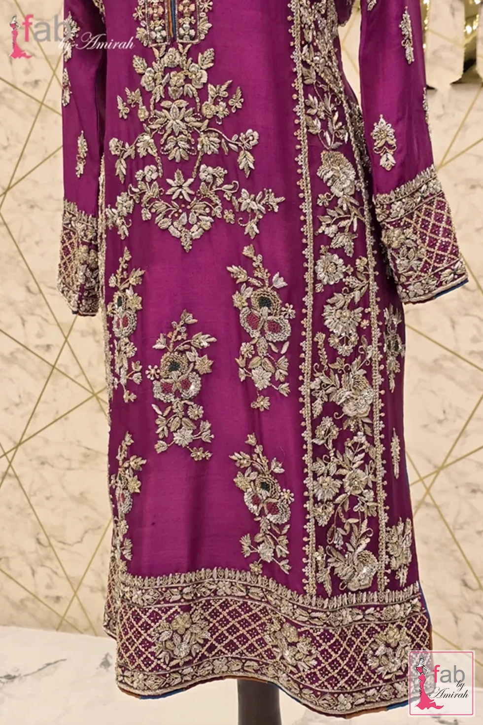 Mid length front view showing detailed hand embroidery motifs and embellished hemline Mid length front view showing detailed hand embroidery motifs and embellished hemline