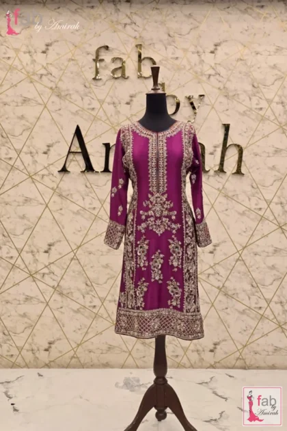 Peach Organza Suit with velvet dupatta in rich magenta raw silk with intricate hand embroidery on mannequin