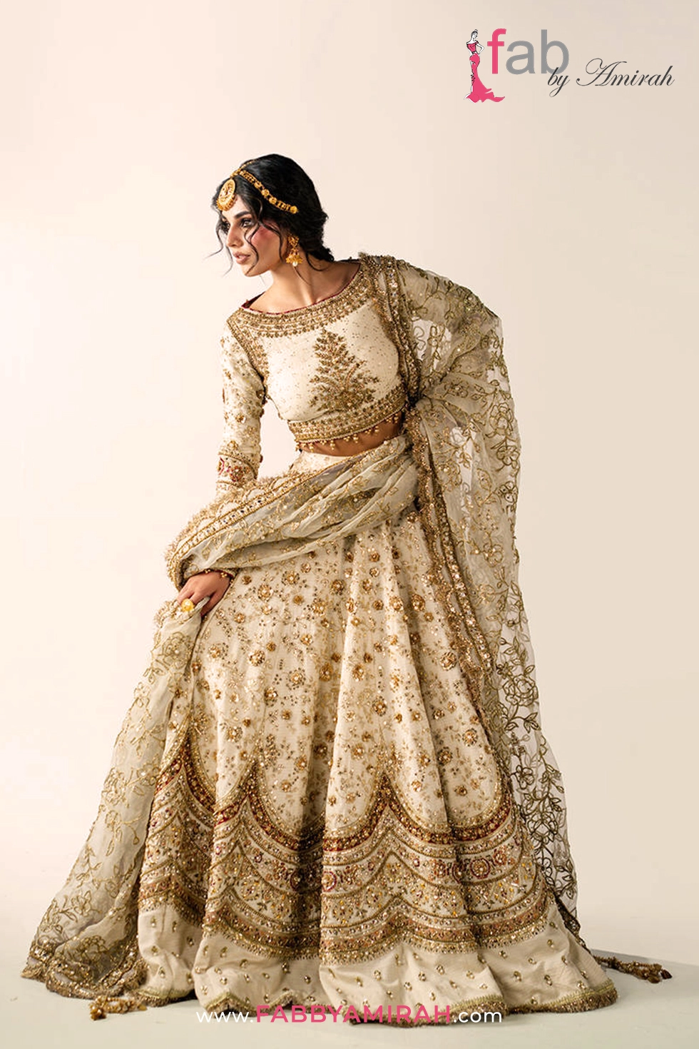 Off white gold bridal lehenga in tilla karandi with red jamawar borders by Fab By Amirah