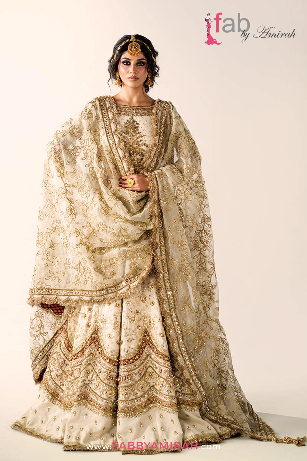 Complete off white gold bridal lehenga set with pink tissue accents for Barat