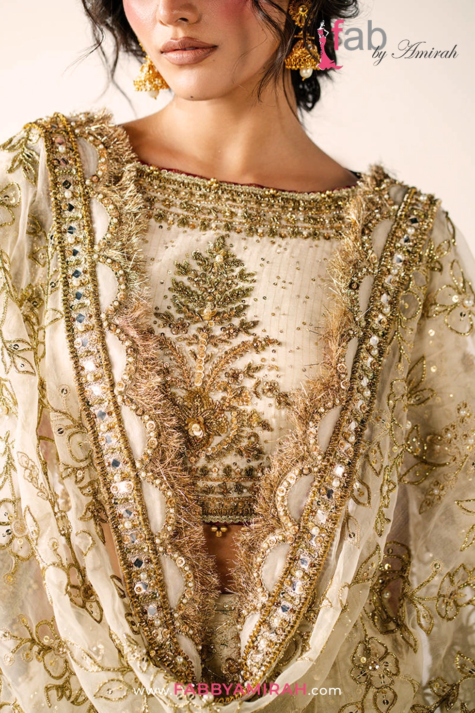Close-up of pita and naqshi work on off white gold bridal lehenga ensemble