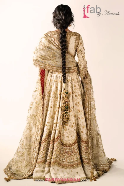 Back view of ivory choli and off white gold bridal lehenga embroidery pattern
