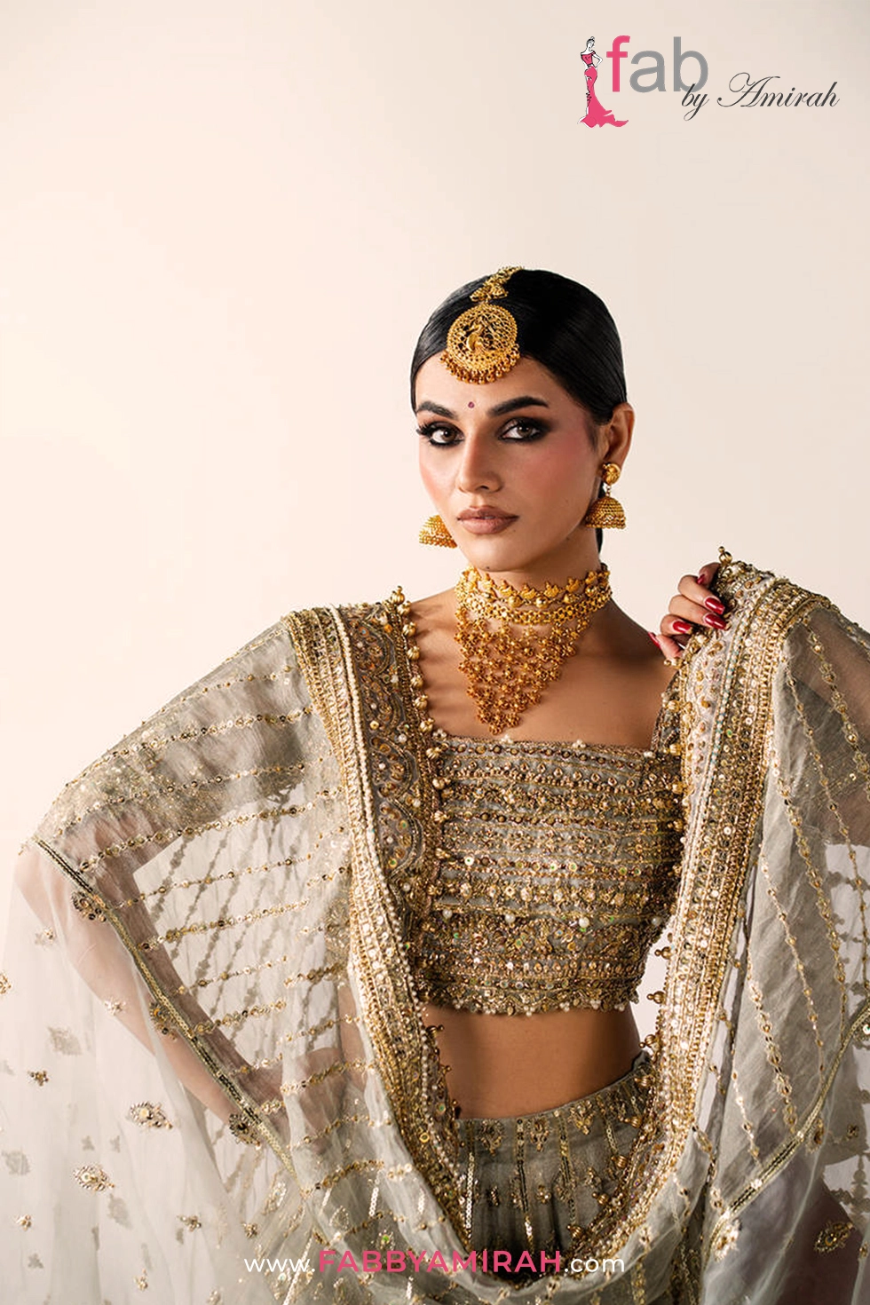 Close-up of handcrafted Sitara and Naqshi work on grey bridal lehenga Close-up of handcrafted Sitara and Naqshi work on grey bridal lehenga