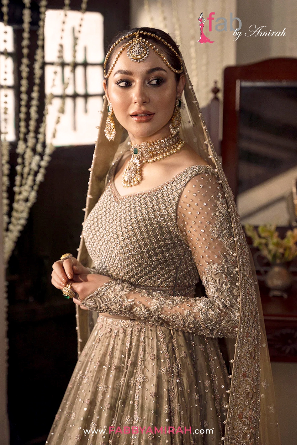 Heavy handcrafted beige lehenga styled for traditional Barat ceremony