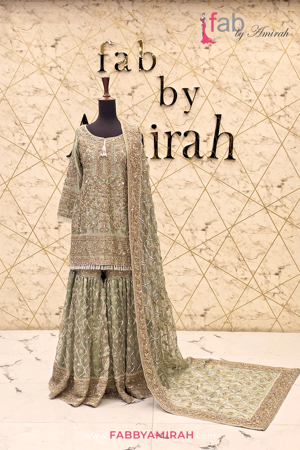Regal sage green sharara styled for luxurious Mehndi ceremony