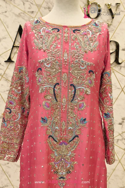 Close-up of Zardozi on coral pink embroidered straight shirt