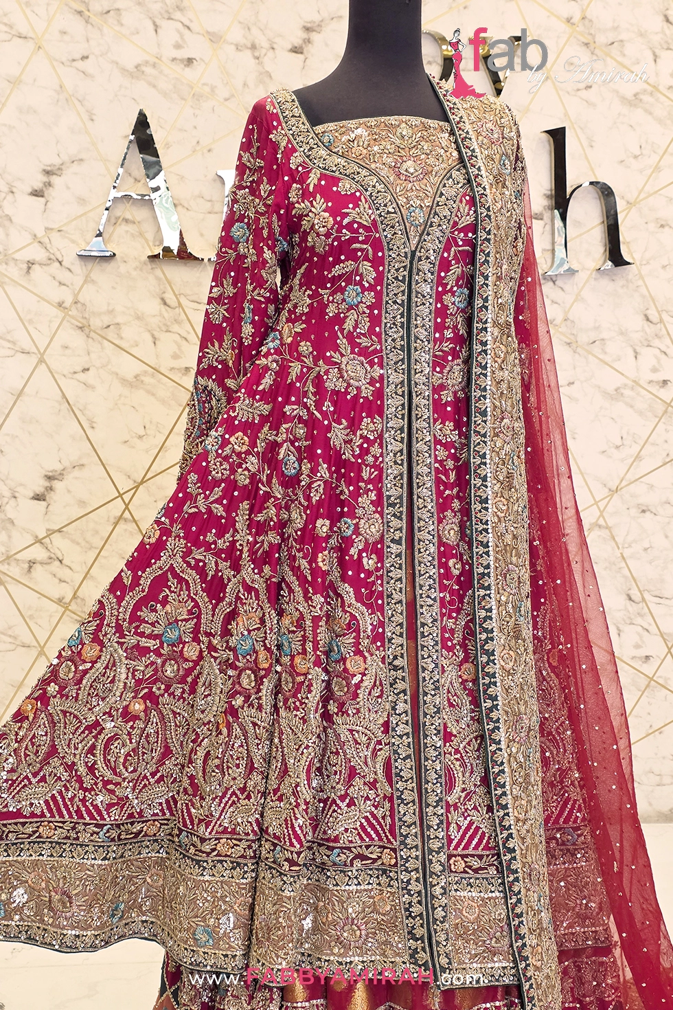 Intricate hand-stitched needlework on premium raw silk bodice dress