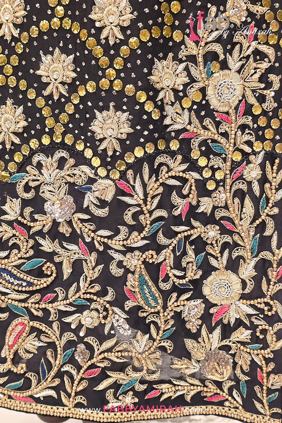 Close-up of dabka embroidery on black raw silk shirt