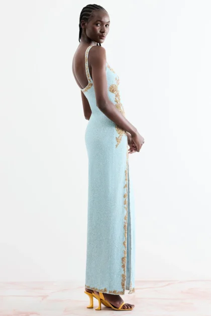 Side angle look showing long straight line of elegant starfish maxi gown