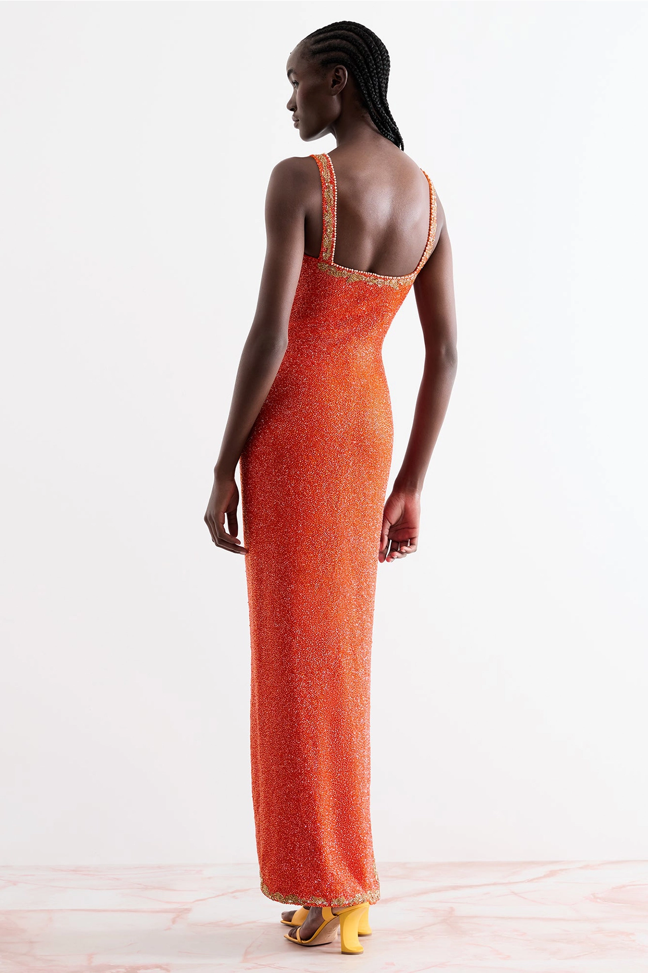 Back flat lay view of pretty cocktail dress with straps in rose pink color