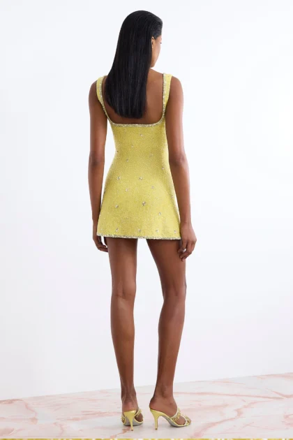 Back view of yellow dress with crystals showing straight clean lining look